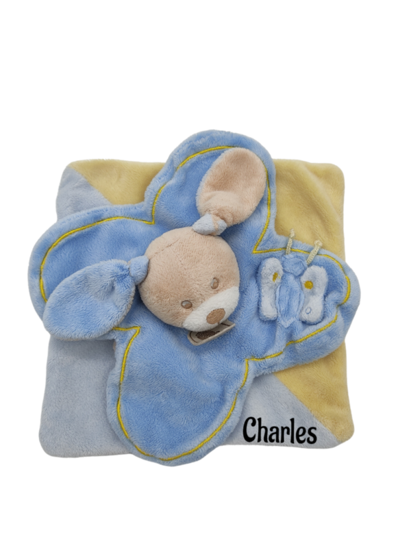doudou-carre-chien-bleu-et-jaune-baby-nat.png Rémi le préféré des bébés - Doudou personnalisé