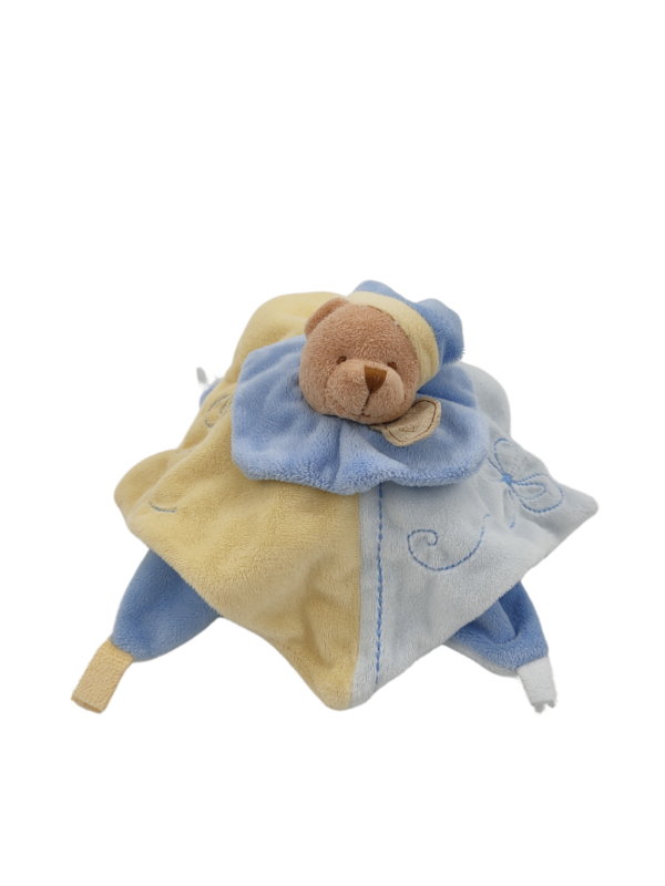 doudou-ours-bleu-et-jaune-plat-baby-nat-2.png Wiz Le protecteur de sourires - Doudou personnalisé